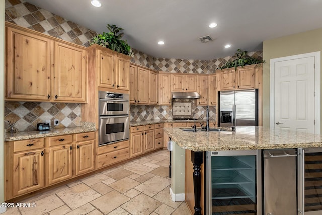 3531 E Norwood Cir, Mesa, AZ 85213 - kitchen with beverage cooler, stainless steel appliances, recessed lighting, a center island with sink, and stone tile flooring