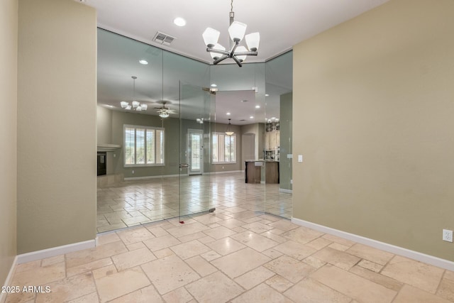 3531 E Norwood Cir, Mesa, AZ 85213 - unfurnished room with a chandelier, recessed lighting, stone tile floors, a glass covered fireplace, and ceiling fan