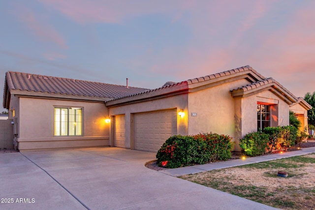 3531 E Norwood Cir, Mesa, AZ 85213 - mediterranean / spanish-style house featuring a garage, driveway, stucco siding, and a tile roof