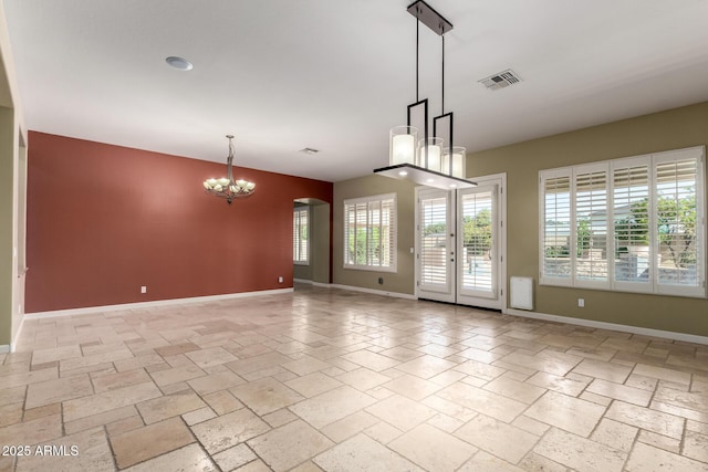 3531 E Norwood Cir, Mesa, AZ 85213 - spare room with a chandelier, stone tile flooring, and arched walkways