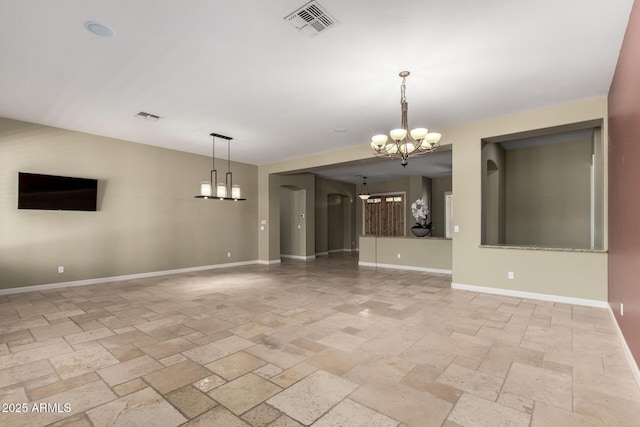 3531 E Norwood Cir, Mesa, AZ 85213 - empty room featuring a chandelier and stone tile floors