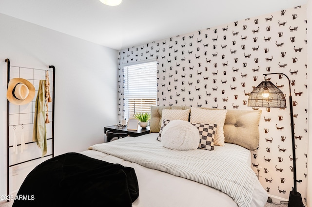 bedroom featuring wallpapered walls
