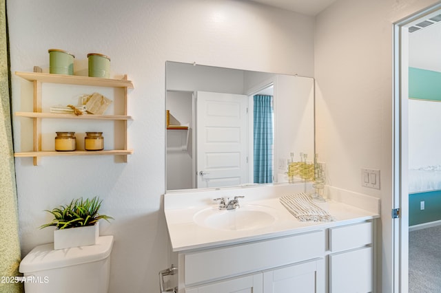 half bathroom with toilet and vanity