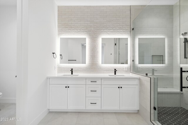 bathroom featuring tile patterned flooring, an enclosed shower, toilet, and vanity