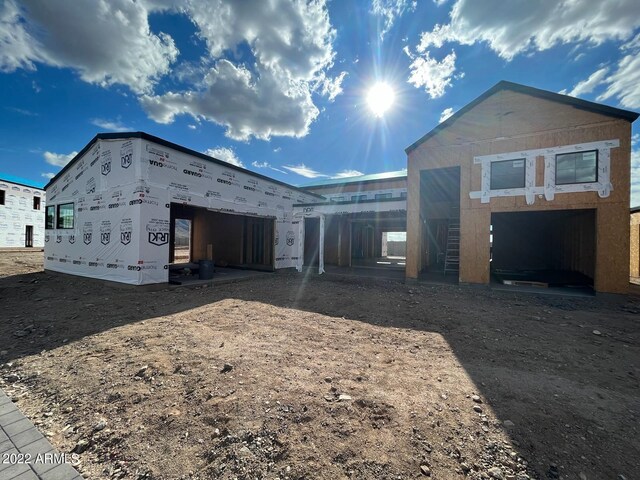 unfinished property featuring a carport