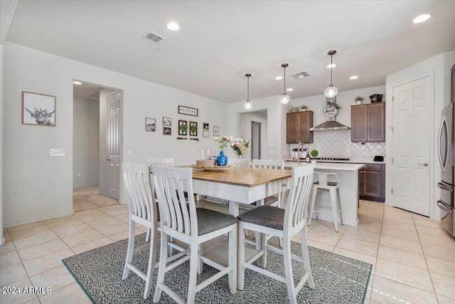 dining space with light tile patterned flooring