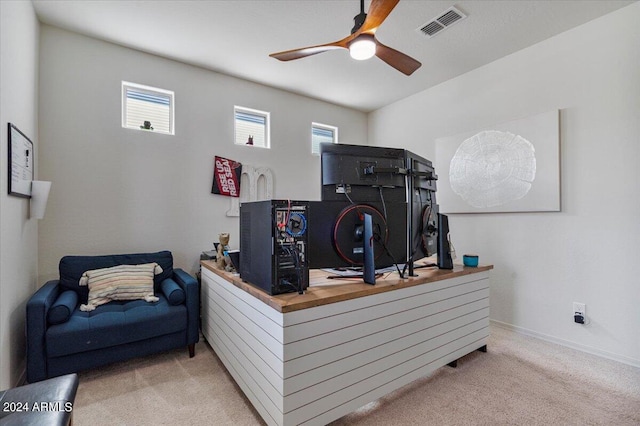 office area featuring light colored carpet and ceiling fan