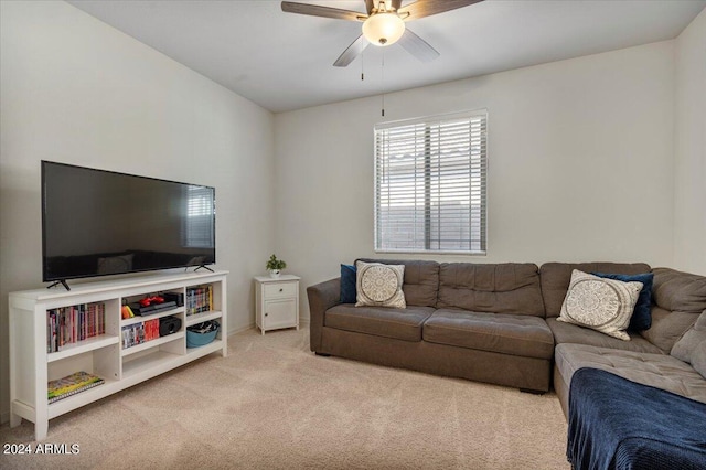 living room with light colored carpet and ceiling fan