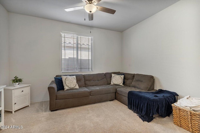 carpeted living room featuring ceiling fan