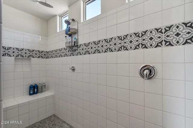 bathroom with tiled shower