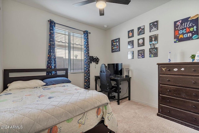 bedroom with ceiling fan and light carpet