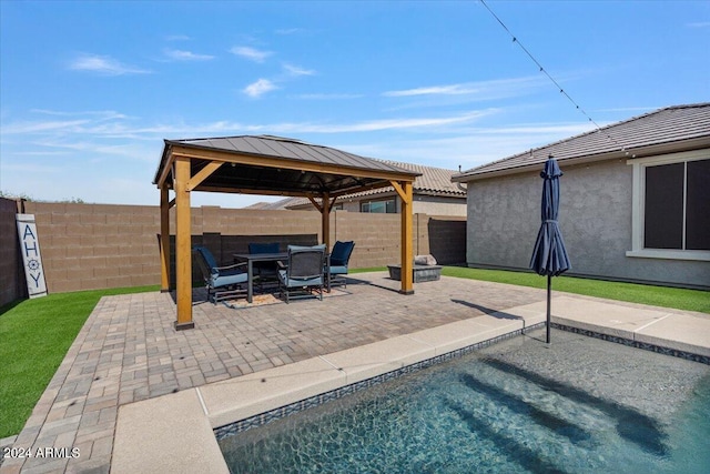 view of swimming pool with a gazebo and a patio area