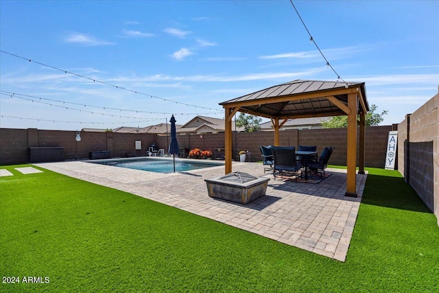 exterior space featuring a yard, a gazebo, a patio, an outdoor fire pit, and pool water feature