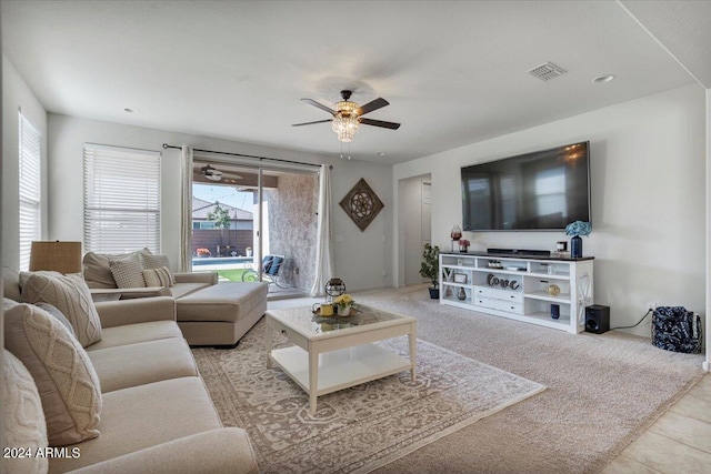 living room with light tile patterned floors and ceiling fan