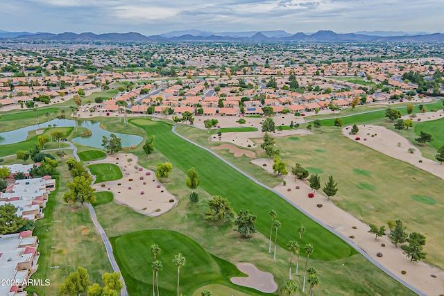 drone / aerial view with a water and mountain view