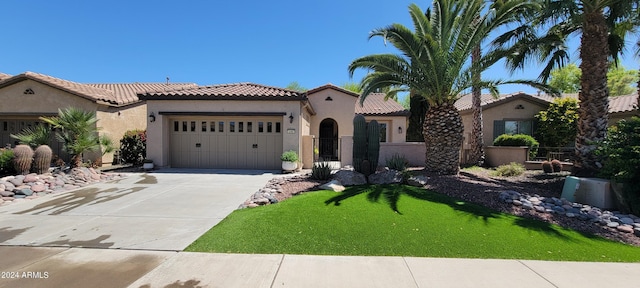 mediterranean / spanish-style house with a garage