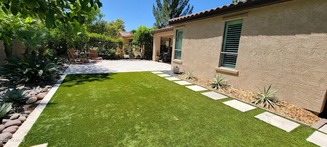 view of yard with a patio area