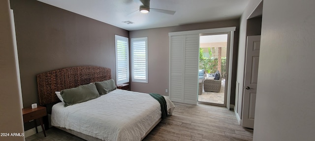 bedroom featuring access to exterior, light wood-type flooring, and ceiling fan