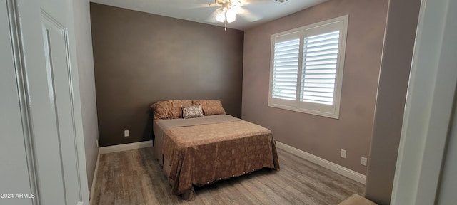 bedroom featuring ceiling fan and hardwood / wood-style floors