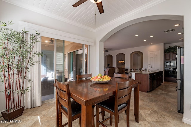 dining space with ceiling fan, wood ceiling, sink, and ornamental molding