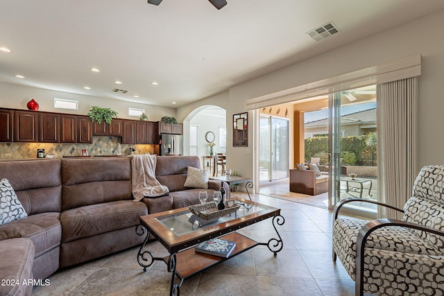 tiled living room featuring ceiling fan