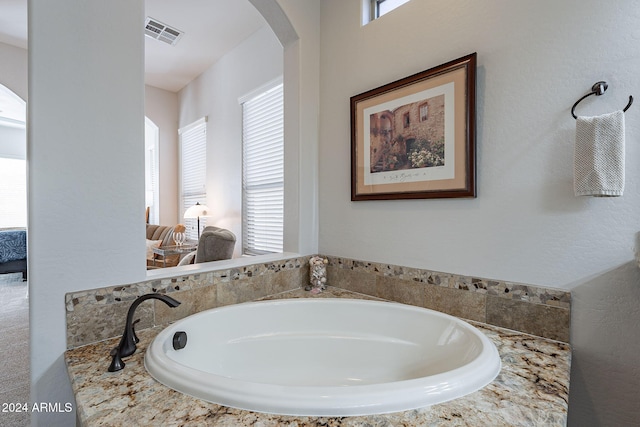 bathroom featuring a bath