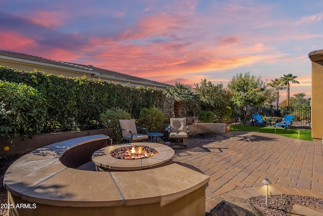 patio terrace at dusk with a fire pit