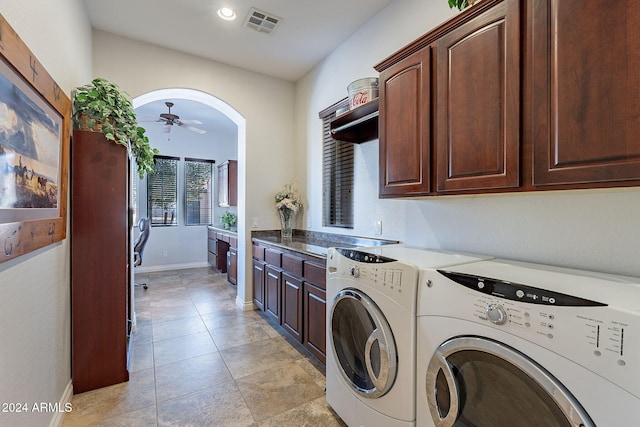 washroom with ceiling fan, independent washer and dryer, and cabinets