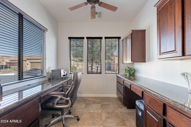 office area with ceiling fan and built in desk