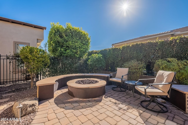 view of patio with a fire pit