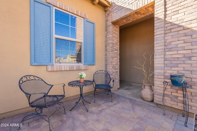 entrance to property with a patio