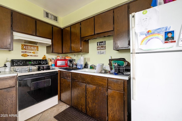414 E Frost Cir, Mesa, AZ 85203 - kitchen featuring white appliances, under cabinet range hood, light countertops, light tile patterned flooring, and dark brown cabinetry