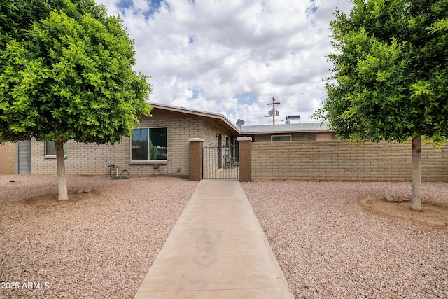 414 E Frost Cir, Mesa, AZ 85203 - single story home with a gate and brick siding