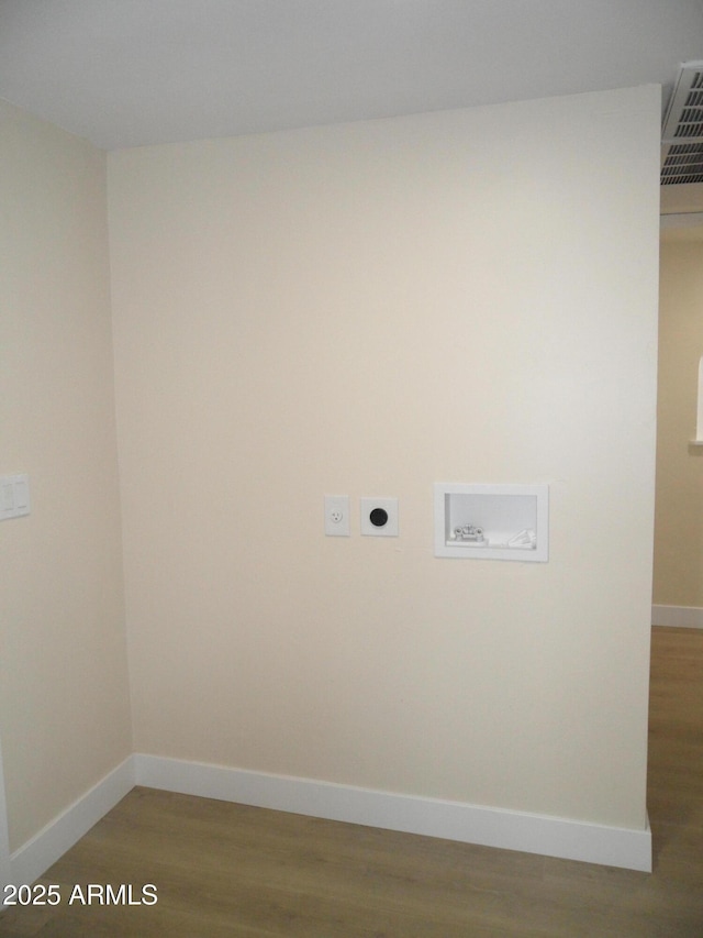 washroom with hardwood / wood-style flooring, electric dryer hookup, and washer hookup