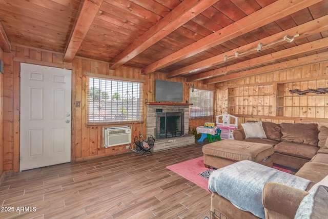 118 E 10th St, Casa Grande, AZ 85122 - living area with wooden walls, beamed ceiling, healthy amount of natural light, an AC wall unit, and wood ceiling