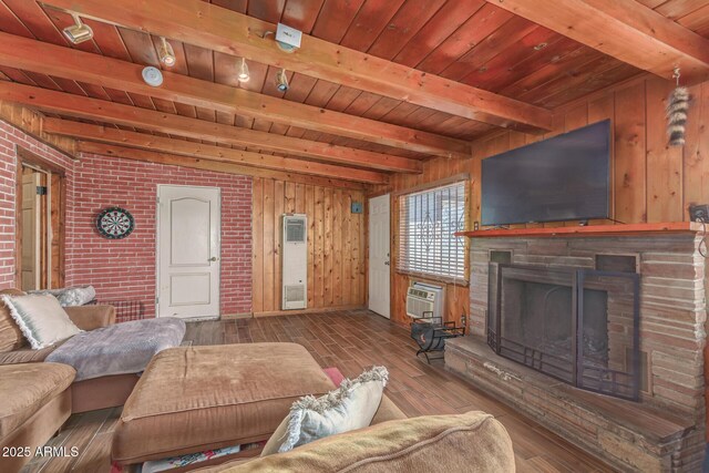 118 E 10th St, Casa Grande, AZ 85122 - living room with beam ceiling, wooden ceiling, hardwood / wood-style flooring, wood walls, and a fireplace