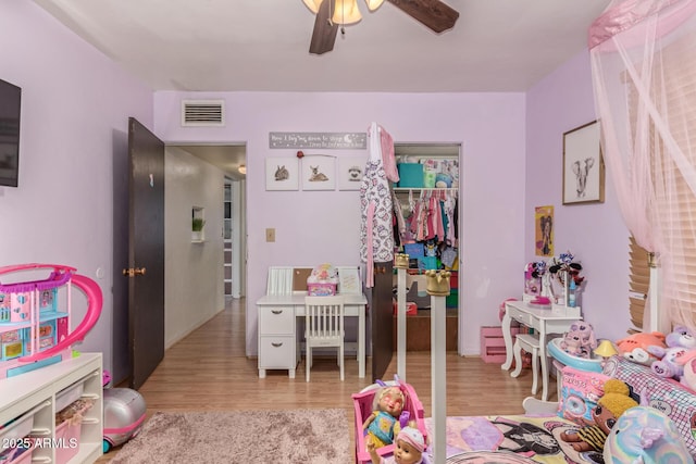 118 E 10th St, Casa Grande, AZ 85122 - playroom featuring a ceiling fan and wood finished floors