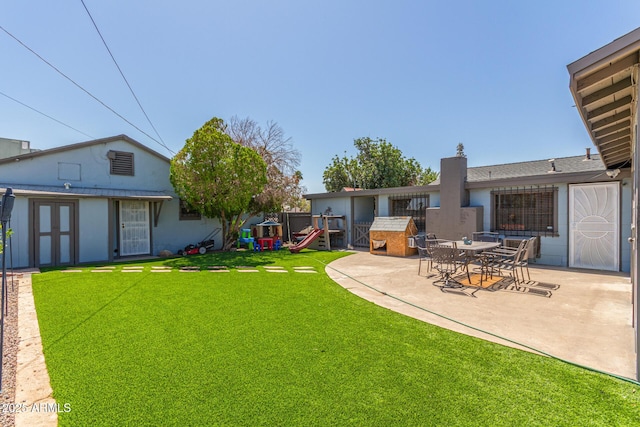 118 E 10th St, Casa Grande, AZ 85122 - view of grassy yard with a patio area