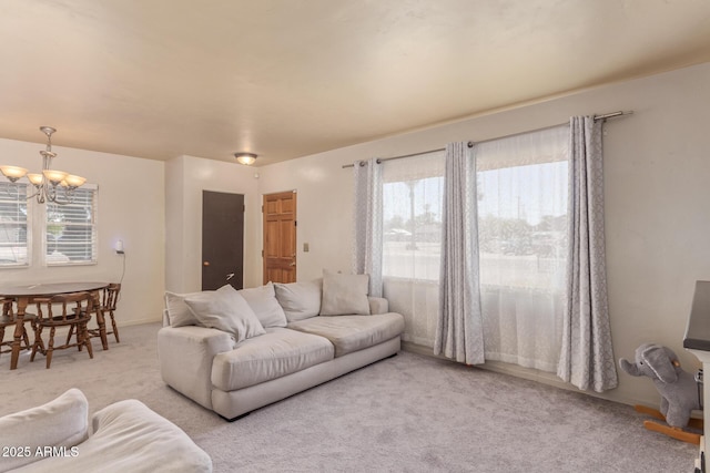 118 E 10th St, Casa Grande, AZ 85122 - living area featuring carpet floors, a chandelier, and plenty of natural light
