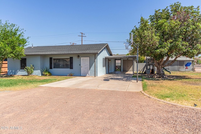 118 E 10th St, Casa Grande, AZ 85122 - ranch-style home with stucco siding, concrete driveway, and a carport