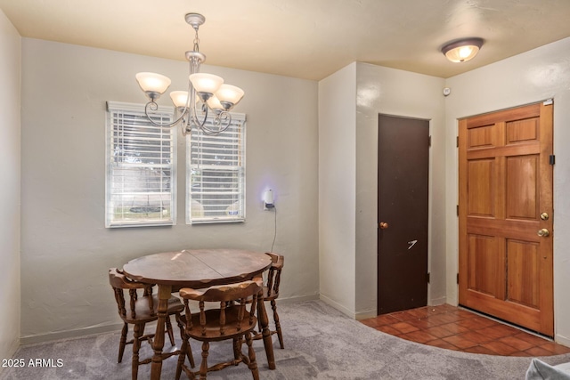 118 E 10th St, Casa Grande, AZ 85122 - dining area featuring a chandelier, carpet flooring, and baseboards