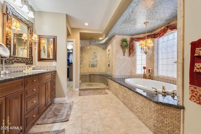 10434 N 44th St N, Phoenix, AZ 85028 - bathroom with a shower stall, a bath, a chandelier, tile patterned flooring, and vanity
