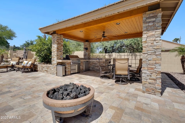10434 N 44th St N, Phoenix, AZ 85028 - view of patio featuring a ceiling fan, outdoor dining area, a fire pit, and a gazebo