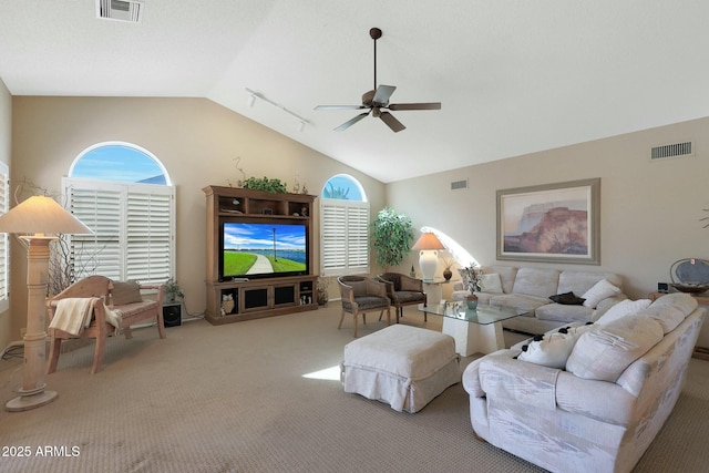 living room featuring ceiling fan, track lighting, light carpet, and vaulted ceiling