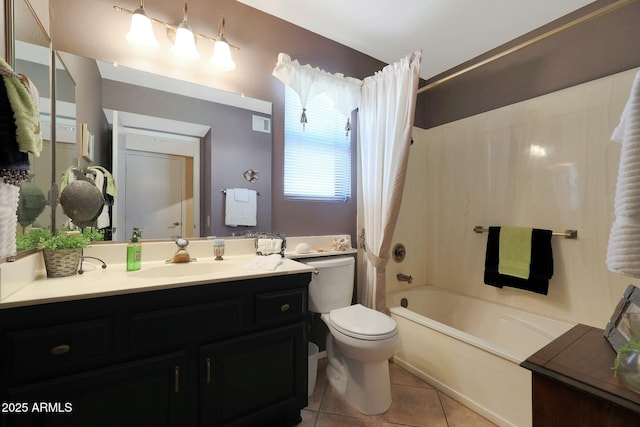 full bathroom featuring vanity, toilet, shower / bath combo with shower curtain, and tile patterned flooring