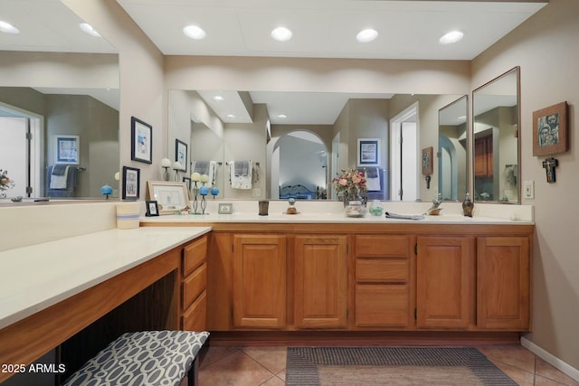 bathroom with tile patterned floors and vanity