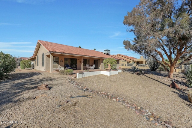 rear view of house featuring a patio area