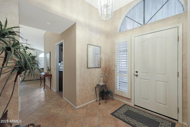 foyer featuring plenty of natural light and light tile patterned floors