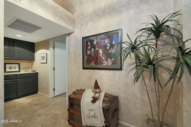 hallway featuring light tile patterned floors