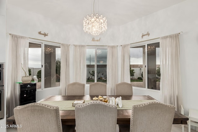 dining space with a notable chandelier